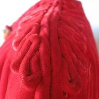 close up detail, cording embellishment at shoulders of 40s red velvet jacket