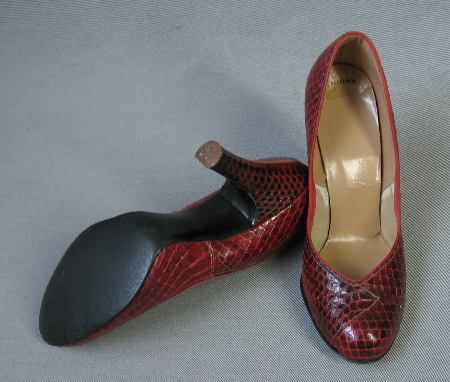 overhead view of rounded toe snakeskin pumps, heels and sole