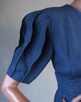 closer view of puffed origami sleeves on 80s cocktail dress