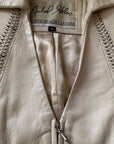 detail view of braided leather seaming, and label for North Beach Leather Micahel Hoban
