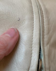 close up of small pen mark to leather on vintage jacket