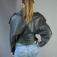 back view, 80s high style motorcycle jacket by Michael Hoban with batwing sleeves