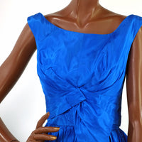 bodice of 50s taffeta cocktail dress showing intricate draping and folding detail at bust and waist