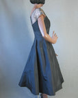 side view, fit and flare 50s designer cocktail dress