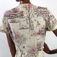 closer view, back bodice of novelty print dress depicting park bandshell, chairs and benches