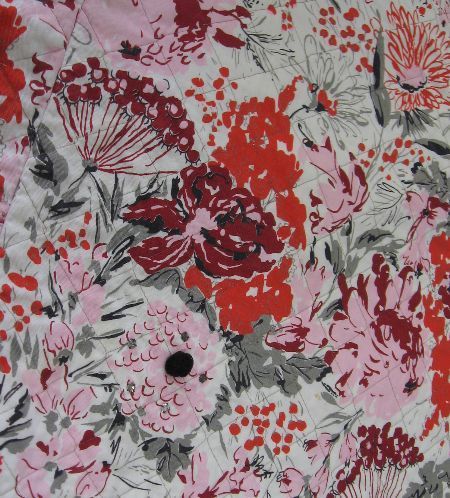 close up, floral print circle skirt 50s vintage with pompom