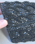 close up view, 960s black clutch fully covered in beads and sequins