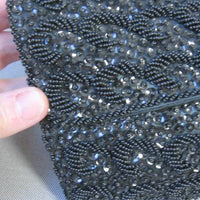 close up view, 960s black clutch fully covered in beads and sequins