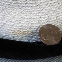closeup of small flaw on straw of hat