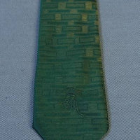 close up, 1960s sharkskin neck tie green to gold