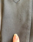 closeup detail of left lapel where pins were attached