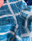 close up view of mild color blur and seam repair under arm