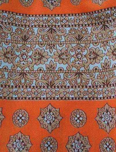 close up detail, orange white and brown paisley striped fabric