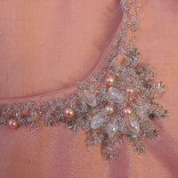 close up details, pearl and bead embellishemnt at neckline of 60s dolly dress