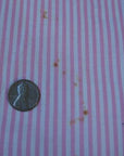close up detail, tiny rust stains on 40s pink pinafore dress