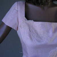 close up view, lace applique at square neckline