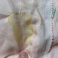 closeup of lining stain that does not go through to the dress fabric