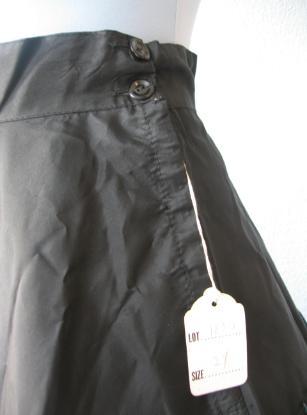 close up detail, hang tag for never worn 50s full skirt