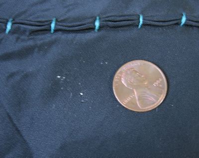 close up detail, small area of pinholes on never worn 50s skirt