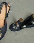 overhead view of floral wreath embroidery on 50s shoes, heels and soles