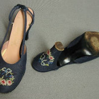 overhead view of floral wreath embroidery on 50s shoes, heels and soles