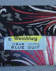 1950s vintage Wembley necktie label with close up of pink to black fade and pattern