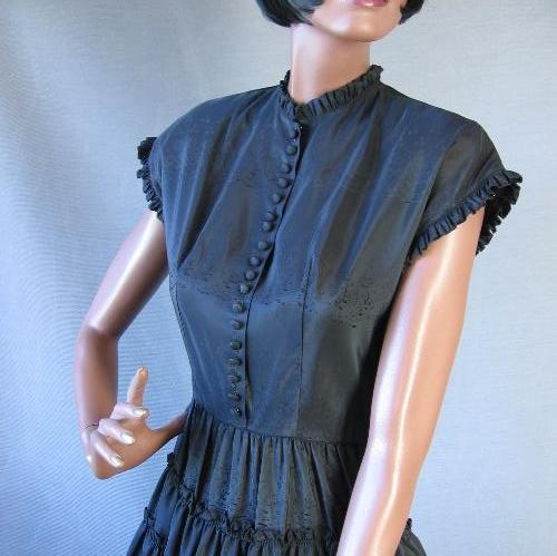 fitted bodice with ruffled cal sleeves and neckline, vintage 50s party dress