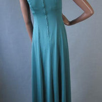 back view,70s  jersey knit green maxidress with high cut armholes