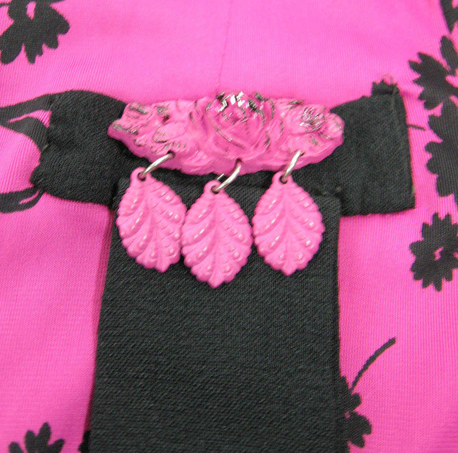 close up detail of attached brooch on 40s shirt