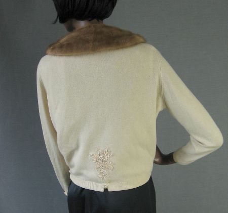 back view, Altmann cashmere cardigan showing embellishment above waist