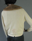 back view, Altmann cashmere cardigan showing embellishment above waist