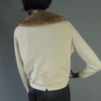 back view, Altmann cashmere cardigan showing embellishment above waist