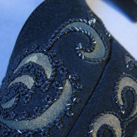 close-up details braid and gold embellishment on Ansonia platform heels