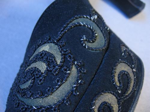 close-up details braid and gold embellishment on Ansonia platform heels