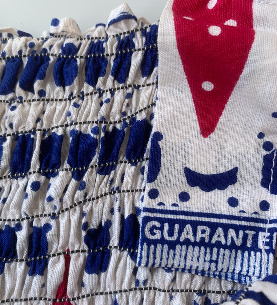close up view of elastic shirring and red white &amp; blue print