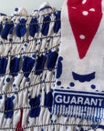 close up view of elastic shirring and red white & blue print
