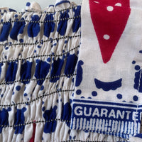 close up view of elastic shirring and red white & blue print