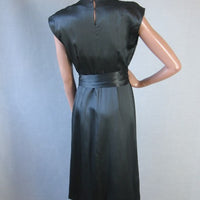 back of black silk cocktail dress