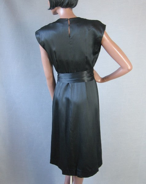 back of black silk cocktail dress