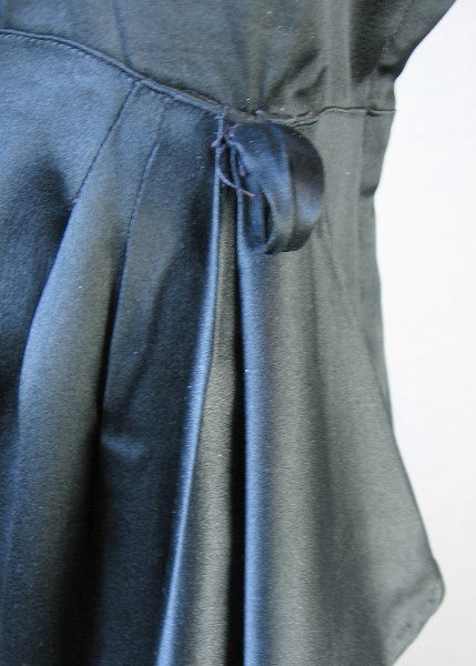 close-up detail draped skirt and sash