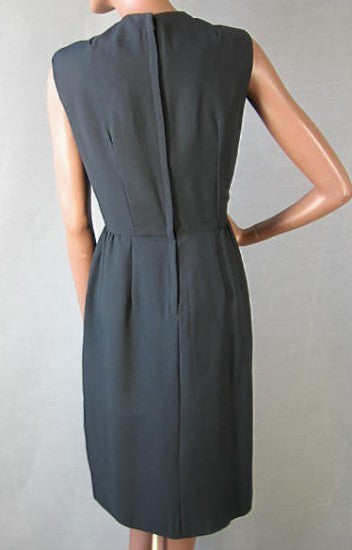 back view, 1960s black sleeveless sheath office to cocktail