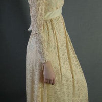side view, 70s long sleeved lace dress with empire waist