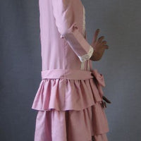side view, 70s flapper style pink dress with tiered ruffled skirt