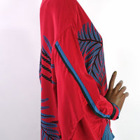 side view of kimono sleeves on 80s red silk dress