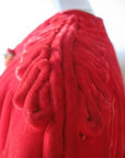 close up detail, cording embellishment at shoulders of 40s red velvet jacket