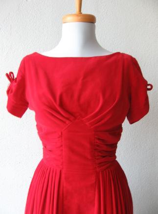 detail view of bodice, red velvet dress, tucked and ruched