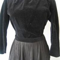 close up of 50s bodice, long sleeved black velveteen blouse top