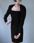 1980s black velvet cocktail dress with strong shoulders