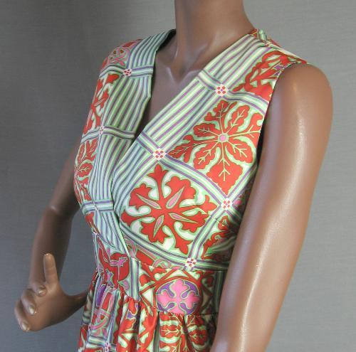 closer view, orange and aqua print vee neck bodice