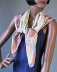 another view of de la Renta scarf tied at neck